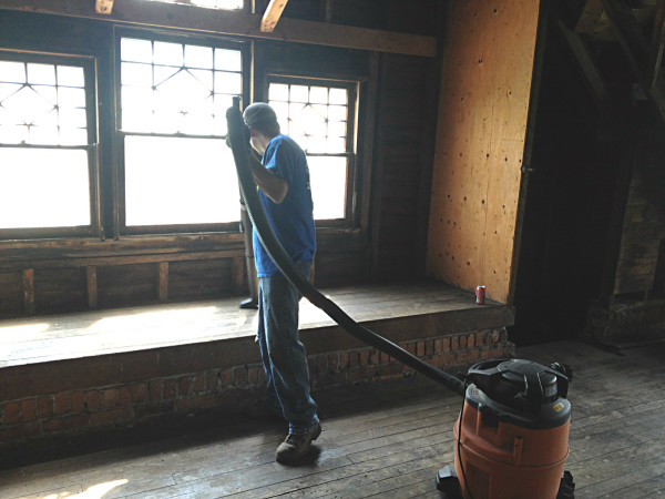 man cleaning up the house